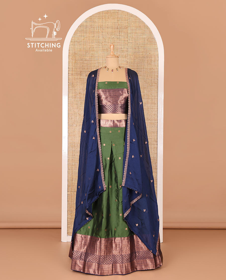 Green taffeta silk half-saree, flower zari buttas and contrast traditional zari bordered skirt, a matching blouse, and contrast embroidered satin georgette scallop dhavani