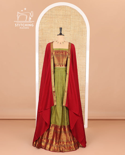 Green half-saree, plain with big contrast traditional zari motifs steeped border skirt, matching blouse and a plain zari border contrast dhavani