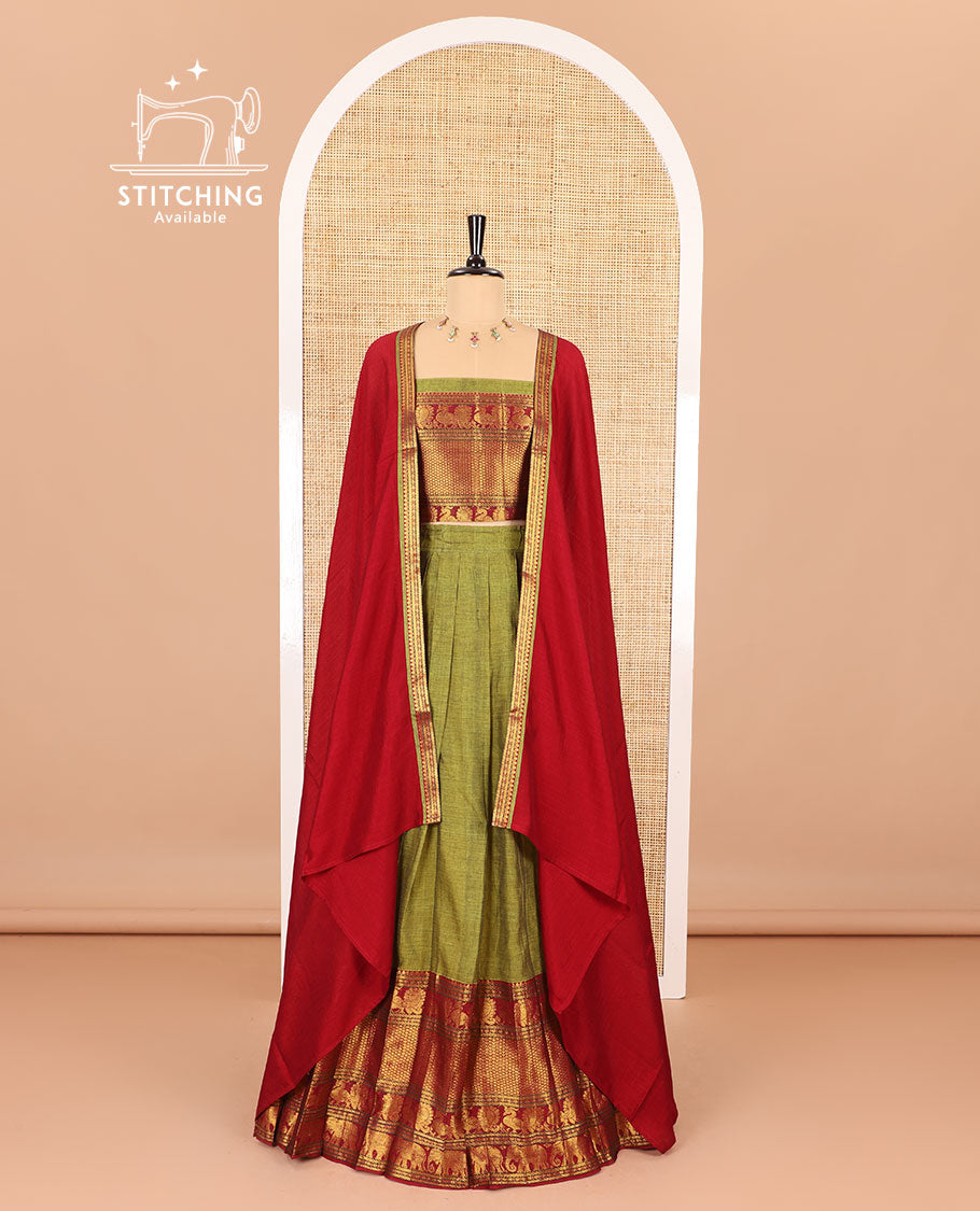 Green half-saree, plain with big contrast traditional zari motifs steeped border skirt, matching blouse and a plain zari border contrast dhavani
