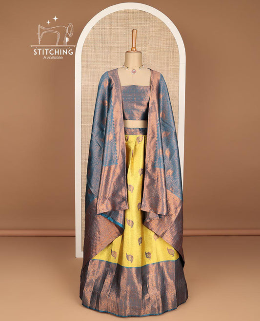 Mustard floral jacquard tissue half saree with contrast zari design border, zari design blouse & floral zari design dhavani