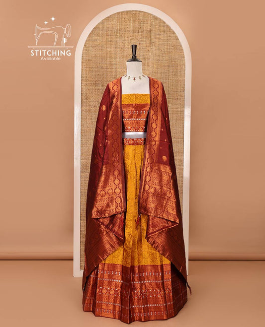 Mustard semi-banaras half-saree, embossed & contrast traditional zari border skirt,blouse of embossed & zari work & contrast-maroon zari design dhavani