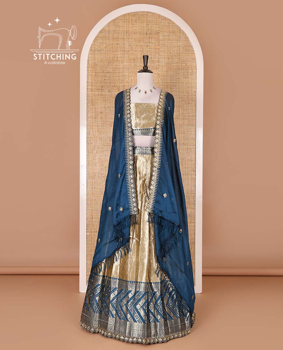 Gold banaras half saree, ogee skirt, contrast peacock blue traditional zari border, matching blouse, and Syska georgette embroidered dhavani