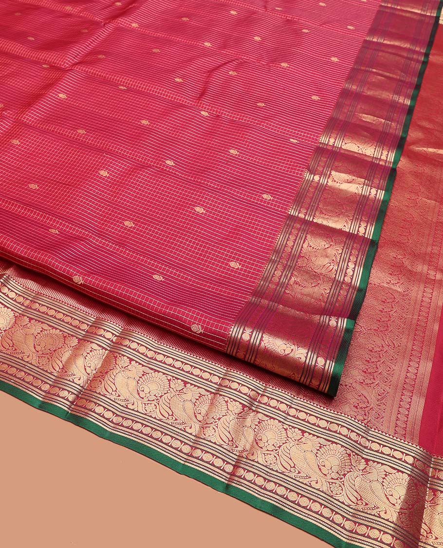 Reddish Pink Vasundhara Silk Saree, Majestically Detailed with Zari Buttas and Micro-Checks on Its Body, Highlighted by Zari Border of Rekku, Muthu, Banaras, Rudraksham, and Mayil Designs, Diagonally Striped Pallu, and Paired with a Contrast Blouse