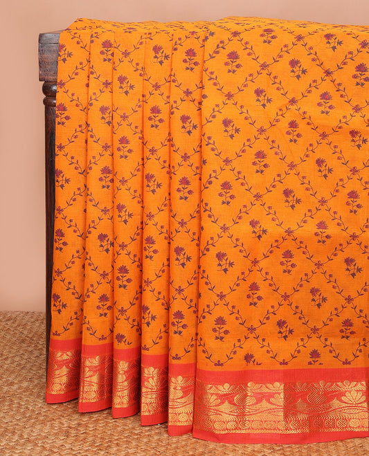 Orange floral jaal printed Andhra cotton saree, contrast traditional zari motif border & zari pallu of paisleys