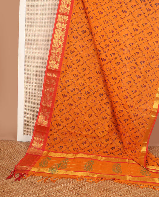 Orange floral jaal printed Andhra cotton saree, contrast traditional zari motif border & zari pallu of paisleys
