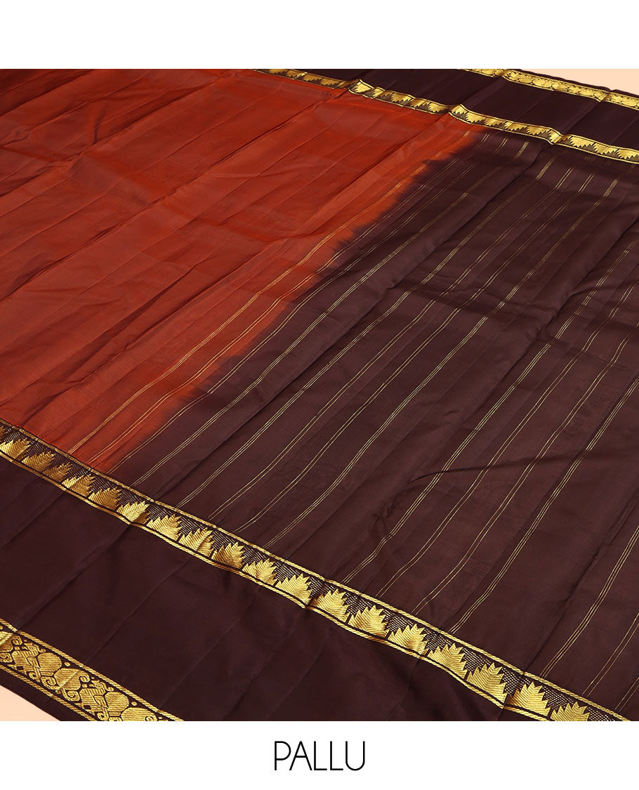 Dark Rust Plain Kanchipuram Silk Saree, a Contrast Rettai Pettu Border of Thazampoo Rekku, Mayil, and Maga Designs, Zari Striped Pallu, and a Contrast Blouse