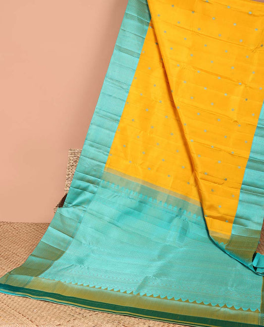 Yellow round buttas kancheepuram silk sare with contrast argyle border & intricate zari pallu