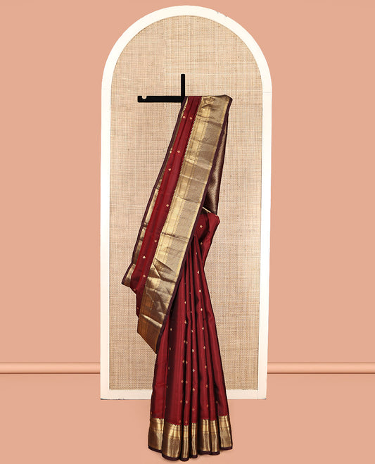 Red Vasundhara Lite Silk Mix Saree, Bedecked with Zari Buttas, a Contrast Border of Thilakam Mokku, Mayil Kann, and Ara Maadam, Grand Pallu, and a Contrast Blouse