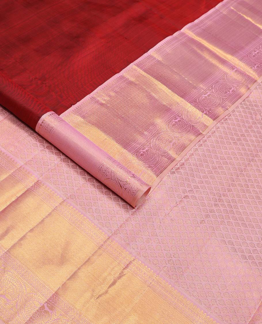 Crimson red floral buttas Kanchipuram korvai silk saree, contrast neer korvai border of thilakam mokku, muthu, kathir, and kodi visiry designs, and zari woven pallu