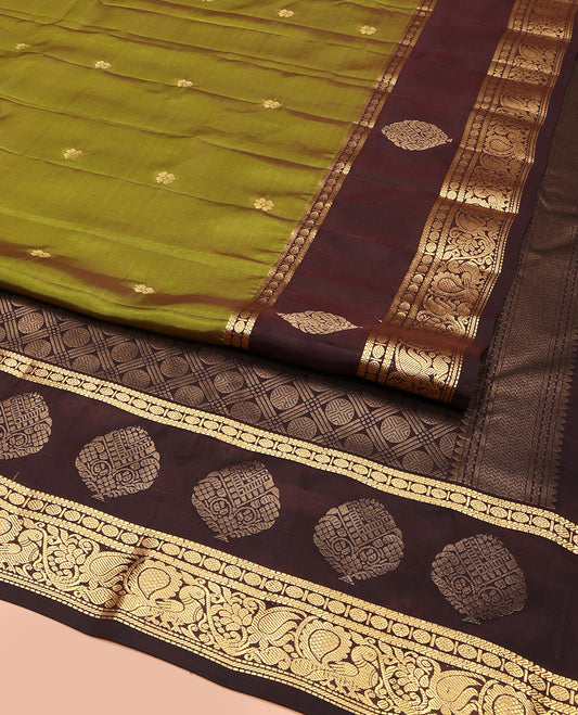 Green Vasundhara Lite Silk Mix Saree, Woven with Zari Buttas, Complemented by a Contrast Border of Muthu, Banaras, Rudraksham, and Mayil Designs, Pallu Elevated with Rudraksham Butta Enclosed Jaal Designs, and Paired with a Contrast Blouse