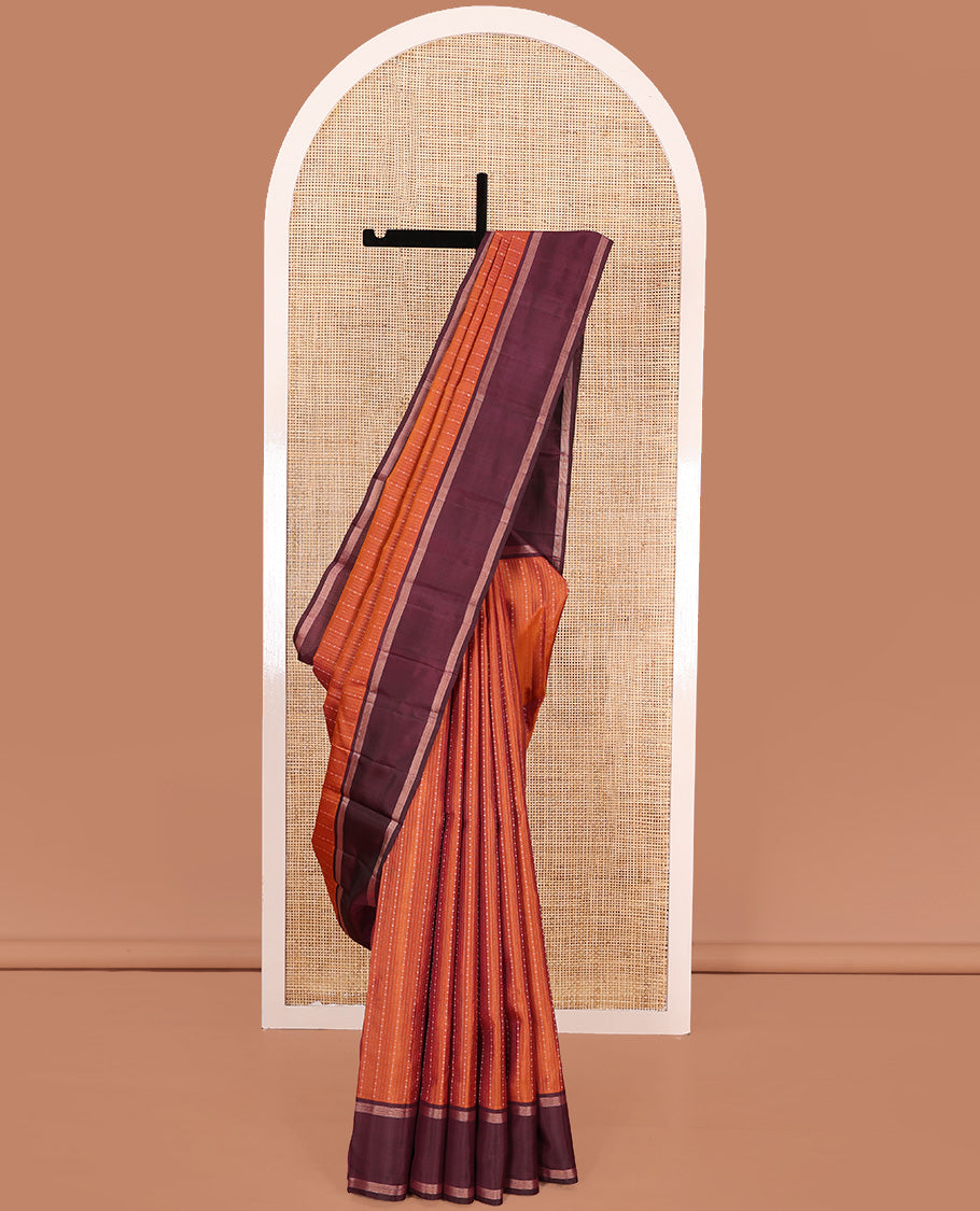 Orange zari design Kanchipuram silk saree, contrast rettai pettu zari striped border, and jaal patterned pallu