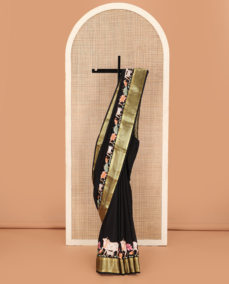 Black delicately thread hand embroidered Mysore silk saree features Pichwai lotus vine, and cow motifs, traditional zari border, and jaal pallu