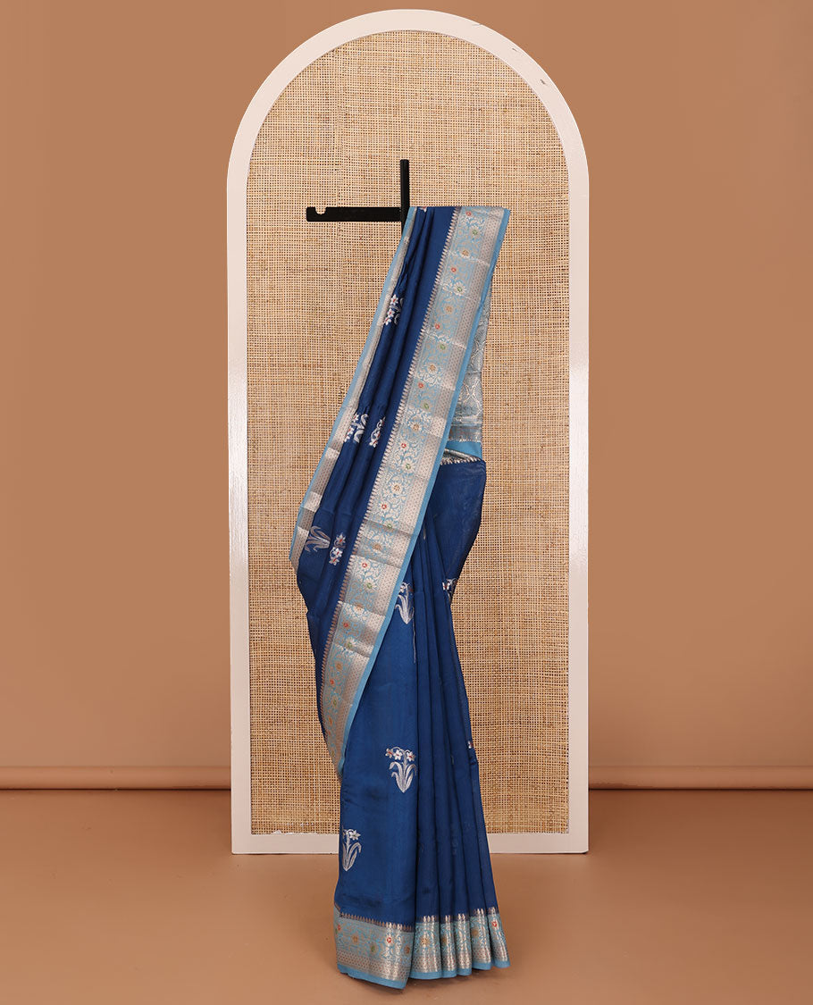 Blue floral buttas raw mango silk saree, contrast traditional zari design border, and intricate pallu