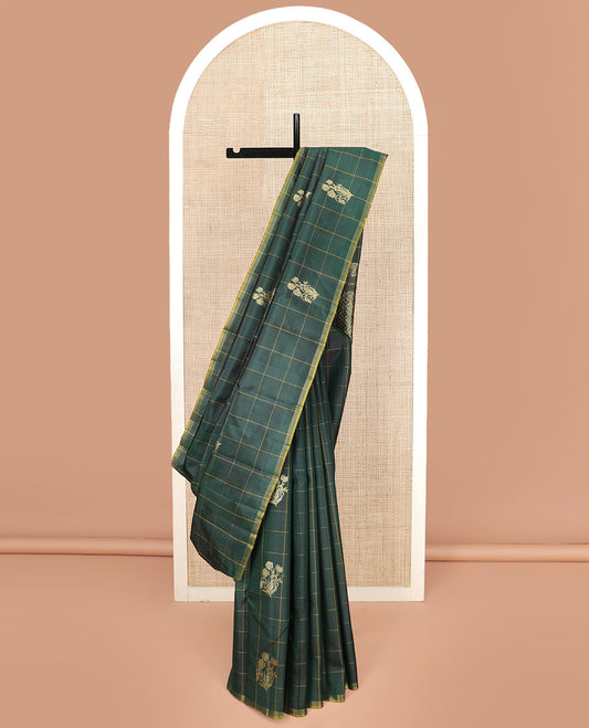 Green Kanchipuram Silk Saree Featuring Floral Zari Buttas Enclosed in Checks, Complemented by a Contrast Striped Border, a Regal Pallu Woven with Intricate Zari Designs, Paired with a Matching Blouse