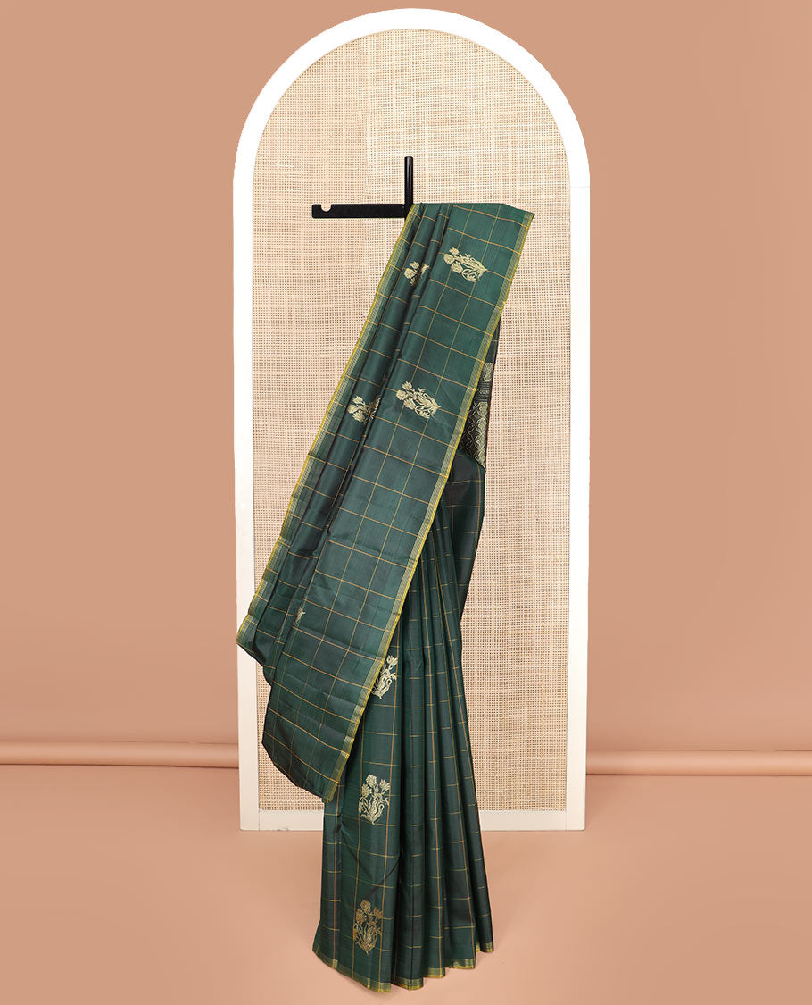 Green Kanchipuram Silk Saree Featuring Floral Zari Buttas Enclosed in Checks, Complemented by a Contrast Striped Border, a Regal Pallu Woven with Intricate Zari Designs, Paired with a Matching Blouse