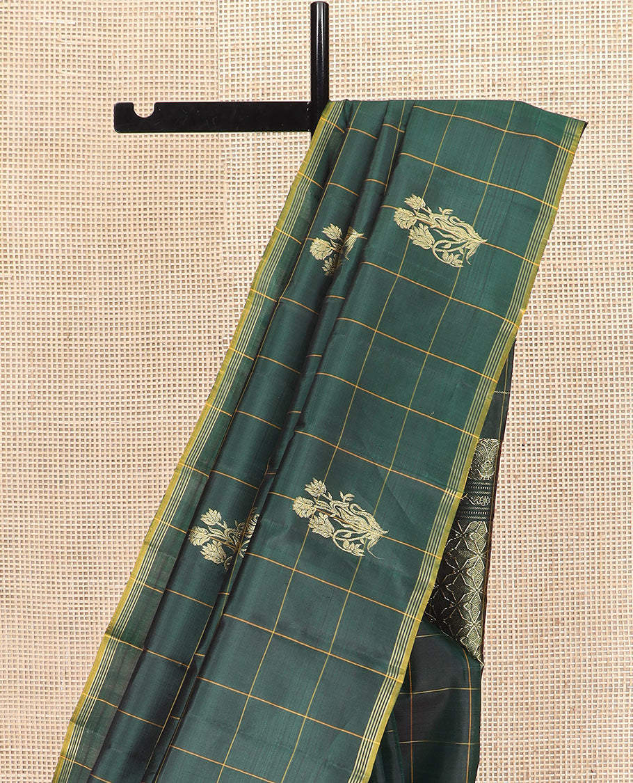 Green Kanchipuram Silk Saree Featuring Floral Zari Buttas Enclosed in Checks, Complemented by a Contrast Striped Border, a Regal Pallu Woven with Intricate Zari Designs, Paired with a Matching Blouse