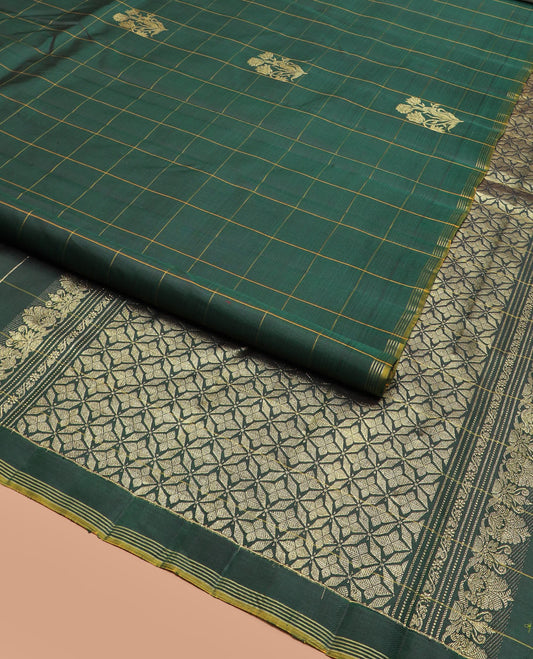 Green Kanchipuram Silk Saree Featuring Floral Zari Buttas Enclosed in Checks, Complemented by a Contrast Striped Border, a Regal Pallu Woven with Intricate Zari Designs, Paired with a Matching Blouse