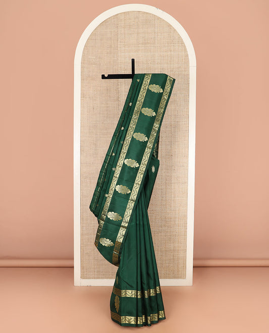 Green Kanchipuram Silk Saree, Finely Designed with Zari Buttas, Highlighted by Zari One-Sided Border of Zari Designs, Grand Pallu of Floral and Scallop Designs, and Comes Without a Blouse