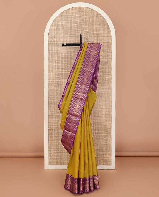 Green zari buttas silk saree, contrast border of thilakam manga mokku, rudraksham,cross neli, and annam chakram, and jaal pallu
