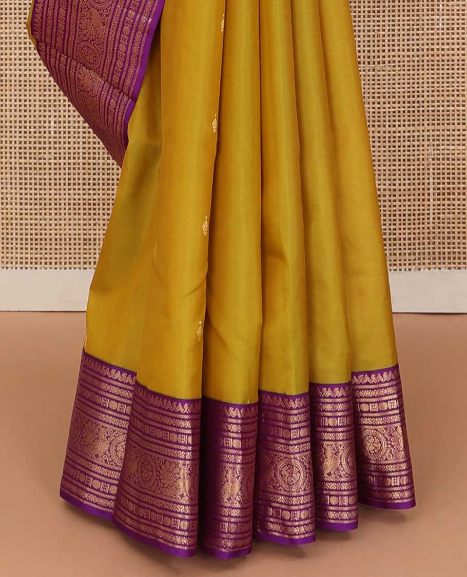 Green zari buttas silk saree, contrast border of thilakam manga mokku, rudraksham,cross neli, and annam chakram, and jaal pallu