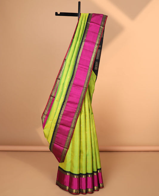 Light green buttas kancheepuram silk saree with contrast rettai pettu, korvai border of intricate zari design & floral striped zari design pallu