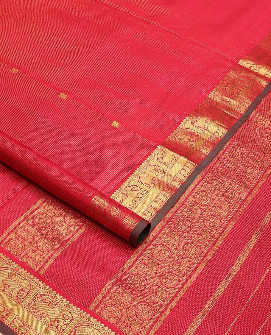Red zari striped and mayil buttas nine-yard silk saree, zari border of thilakam mokku, muthu, yaanai, yaali, and mayil designs, and zari design pallu