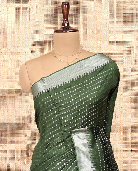 Green Banana Pith Saree, Lightly Embellished with Buttas All Over Its Body, Highlighted by a Zari Temple Border, Gleaming Zari Striped Pallu, and Paired with a Matching Blouse