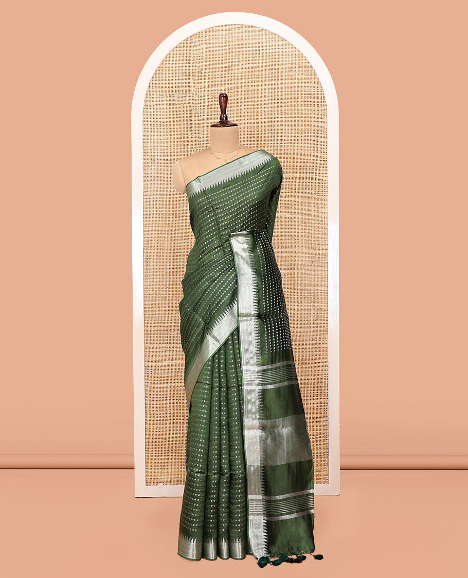 Green Banana Pith Saree, Lightly Embellished with Buttas All Over Its Body, Highlighted by a Zari Temple Border, Gleaming Zari Striped Pallu, and Paired with a Matching Blouse