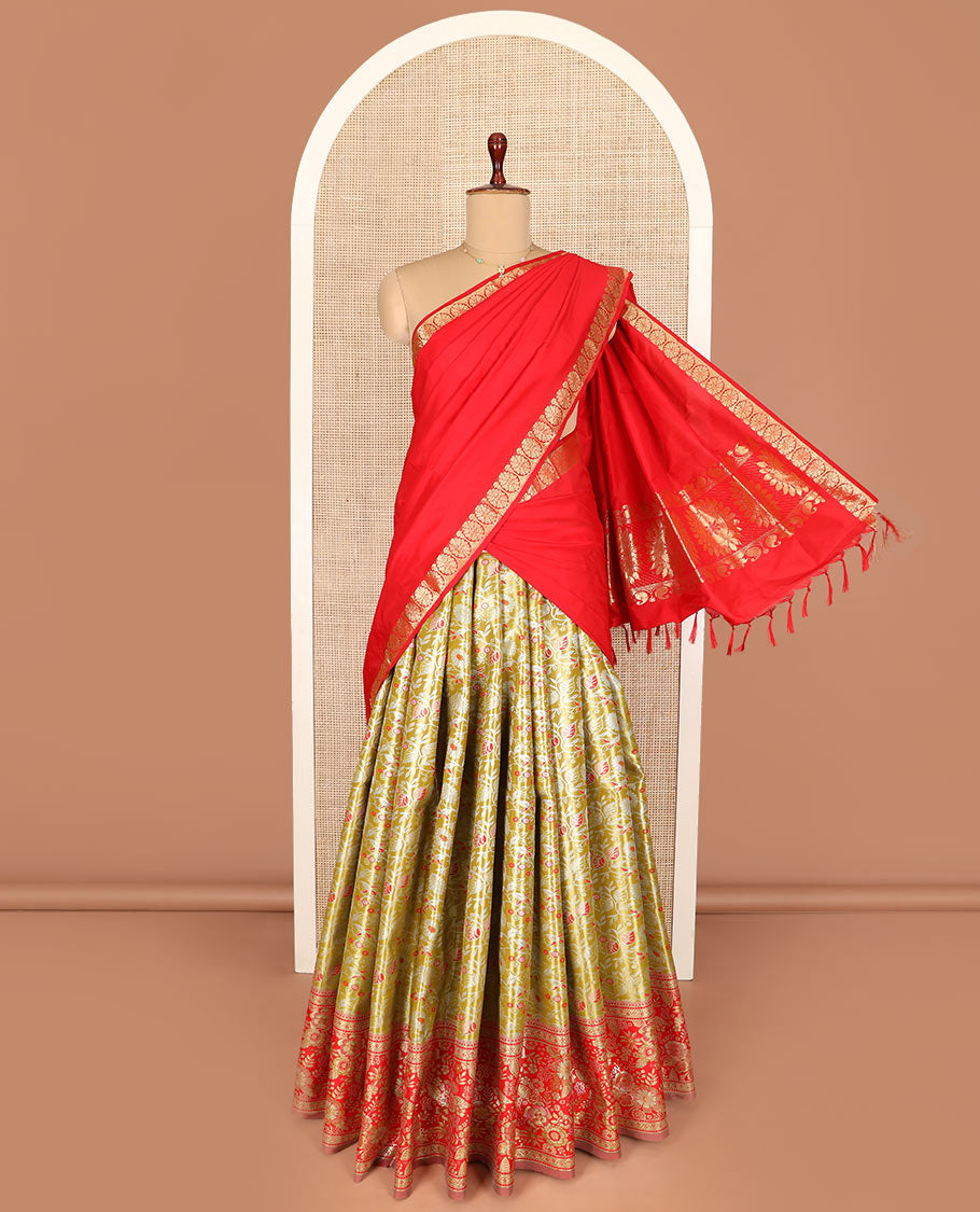Green Art Silk Half-Saree, Majestically Detailed with Jacquard Design on Its Skirt, Complemented by a Contrast Floral Zari Border, Paired with a Contrast Jacquard Blouse, and Featuring a Dhavani Adorned with Chakram Design