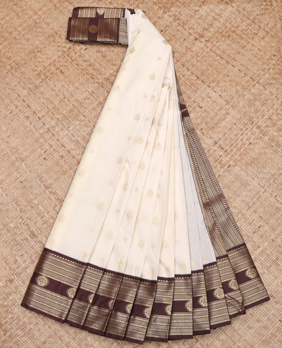 Cream Budget Silk Saree, Highlighted by Zari Buttas on Its Body, Complemented by a Contrast Traditional Zari Design Border, Geometric Patterned Pallu, and Paired with a Contrast Blouse