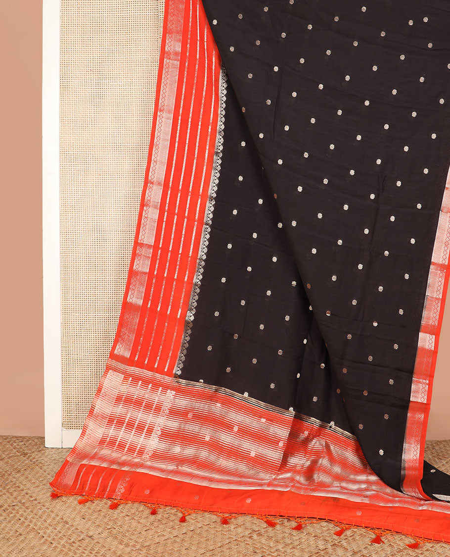 Black floral buttas assam silk saree, contrast traditional zari border, and pallu of stripes and zari buttas