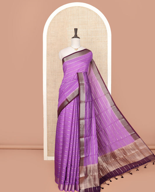 Purple Assam Silk Saree Spotlighted with Zari Stripes, Complemented by a Contrast Dot Enclosed Diamond Patterns Border, a Scintillating Pallu Steeped in Zari Stripes, and Paired with a Contrast Blouse