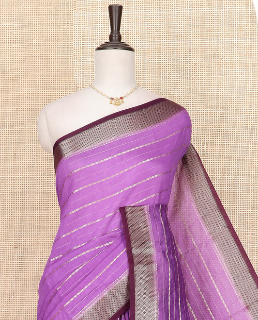 Purple Assam Silk Saree Spotlighted with Zari Stripes, Complemented by a Contrast Dot Enclosed Diamond Patterns Border, a Scintillating Pallu Steeped in Zari Stripes, and Paired with a Contrast Blouse