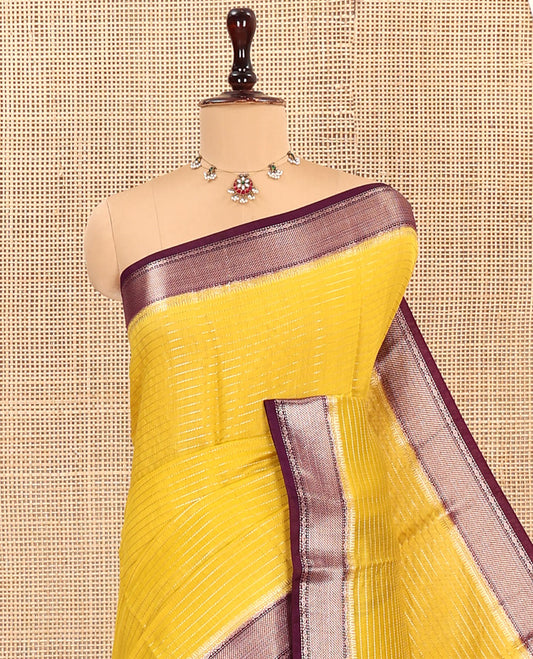 Yellow Assam Silk Saree, Sparsely Sparkled with Zari Stripes, Complemented by Contrast Zari Border of Traditional Designs, Pallu Features Zari Stripes, and Paired with a Contrast Blouse