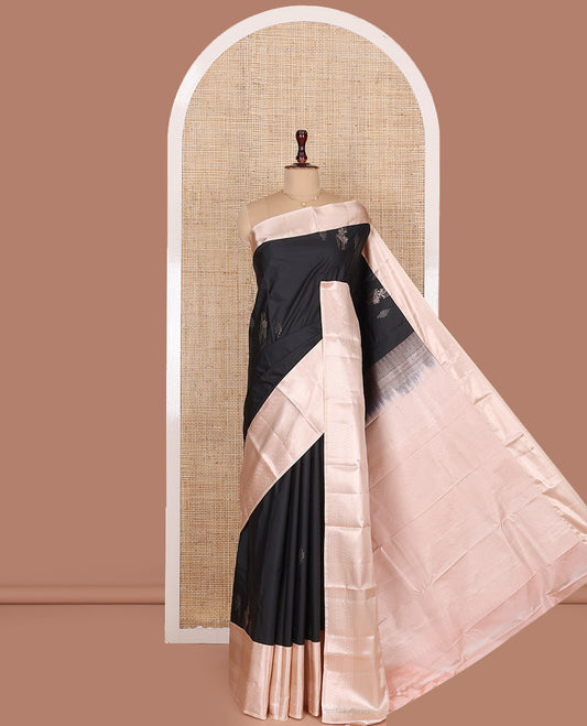Black Budget Silk Saree, Gleamed Up with Zari Buttas All Over Its Body, Complemented by Contrast Border of Traditional Designs Woven in Zari, Grandly Bedecked Pallu, and Paired with a Contrast Blouse