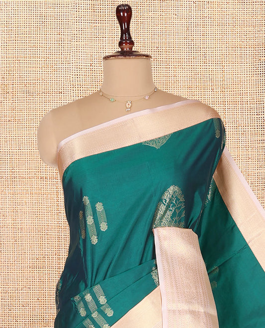 Green Budget Silk Saree, Beautifully Bedecked with Zari Buttas on Its Body, Complemented by a Contrast Traditional Zari Design Border, Grandly Decorated Pallu, and Paired with a Contrast Blouse