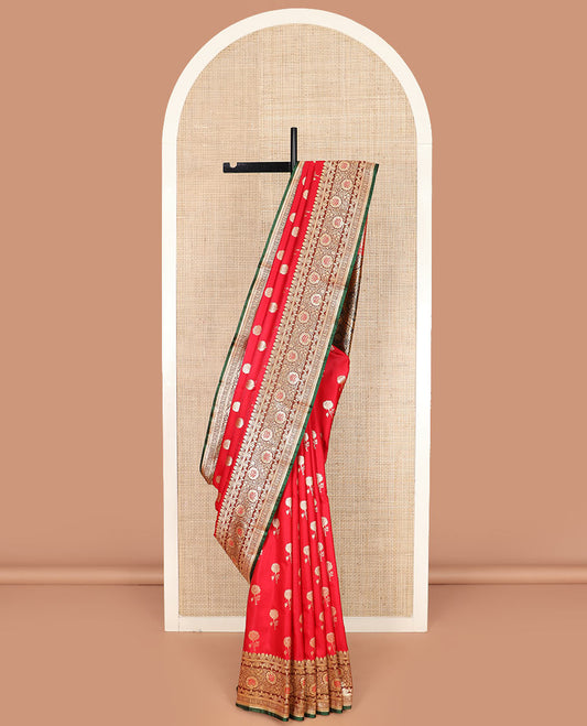 Red floral buttas banarasi silk saree, contrast floral creeper design border, and Mughal-style designs woven pallu