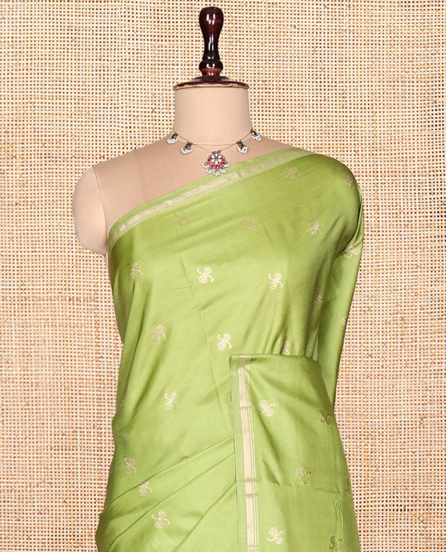 Leaf Green Satin Silk Saree, Enthralled with Zari Buttas, a Subtle Piping Border, Complemented by a Contrast Intricately Designed Pallu, and a Contrast Blouse