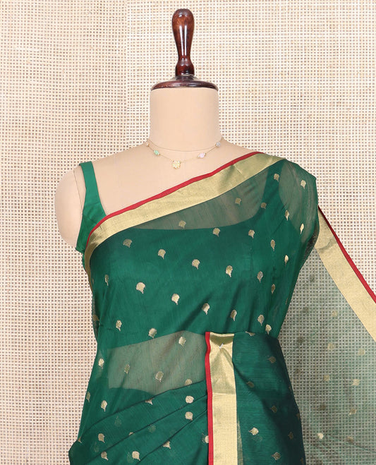 Green Chanderi Cotton Saree, Spotlighted with Zari Buttas All Over Its Body, Highlighted by Zari Border, Pallu of Floral Buttas, and Paired with a Contrast Blouse