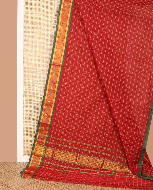 Red Venkatagiri Cotton Saree, Finely Crafted with Buttas and Checks on Its Body, Complemented by a Contrast Thread and Zari Border, Zari-Striped Pallu, and Comes Without a Blouse