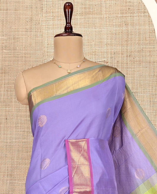 Lavender Poly Cotton Saree, Enthralled with Zari Buttas on Its Body, Complemented by Contrast Ganga-Jamuna Border, Chevron Striped Pallu, and Paired with a Contrast Blouse