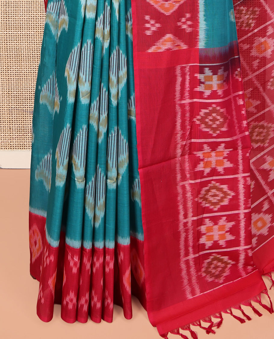 Blue Ikkat Cotton Saree, Decorated with Ikkat-style Buttas All Over Its Body, Complemented by a Contrast Ikkat-Textured Border, Pallu of Butta Enclosed Checks, and Paired with a Contrast Blouse