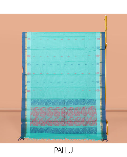 Blue Kanchi Cotton Saree, Decorated with Buttas All Over Its Body, Complemented by a Contrast Border, Pallu of Paisley Design, and Paired with a Matching Blouse