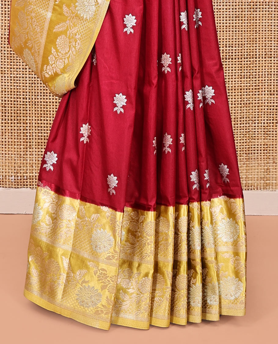 Maroon Mushuru Silk Saree, Elevated with Zari Buttas All Over Its Body, Complemented by Captivating Contrast Border of Floral Jaal Designs, Grandly Decked Up Pallu and Paired with a Contrast Blouse