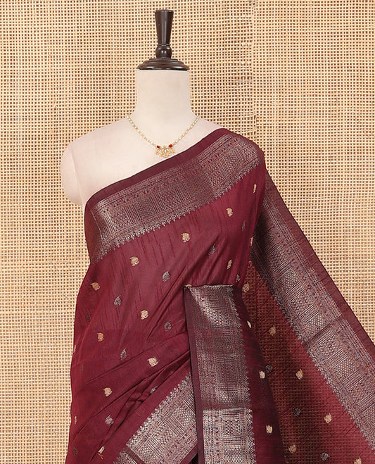 Maroon paisley buttas dupion saree, traditional zari border, and contrast striped pallu