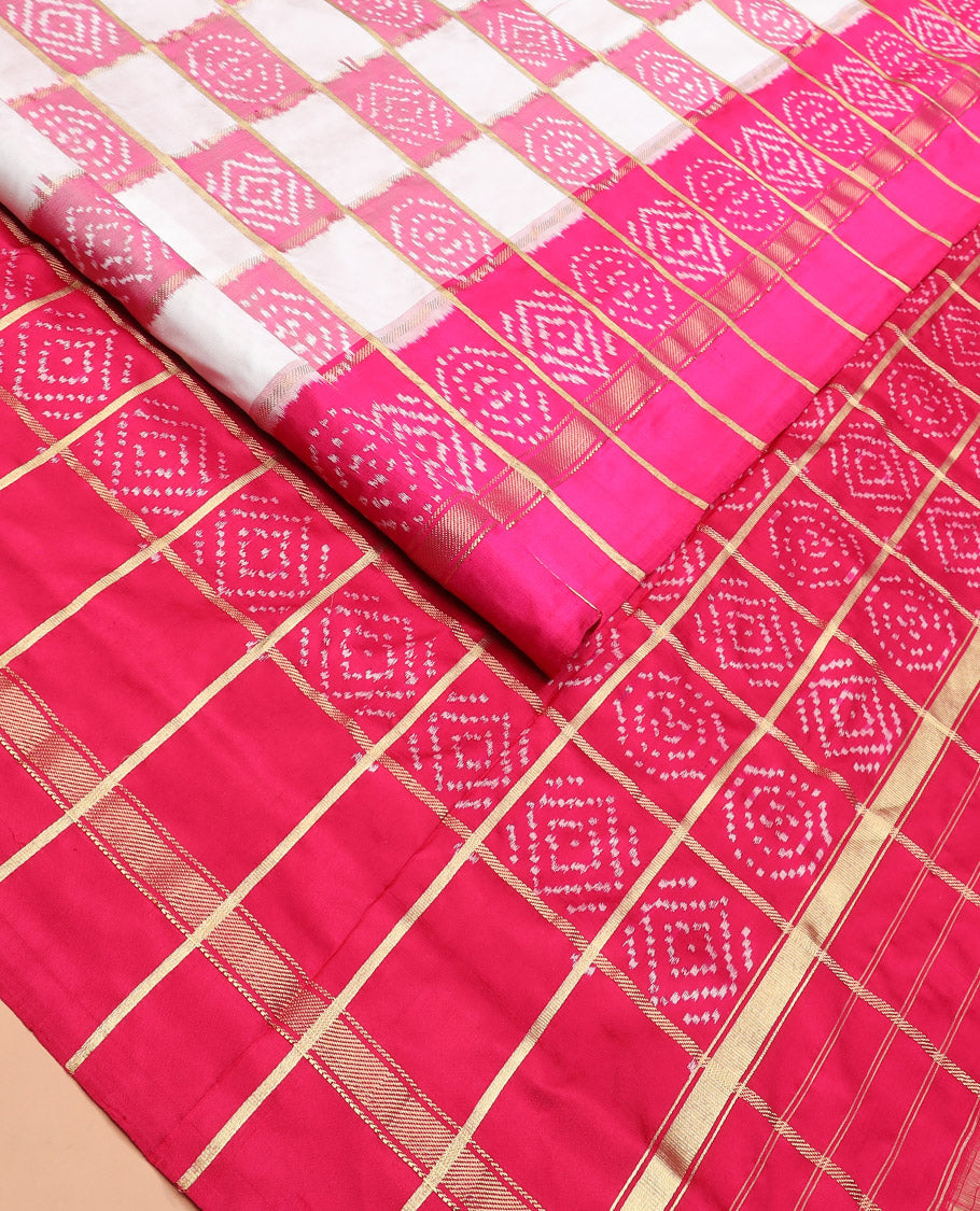 Cream and Pink Ikkat Silk Saree with Ikkat Buttas Enclosed in Checks, Complemented by a Contrast Ikkat Design Border, a Hazily Woven Pallu of Ikkat Patterns, and a Contrast Checked Blouse