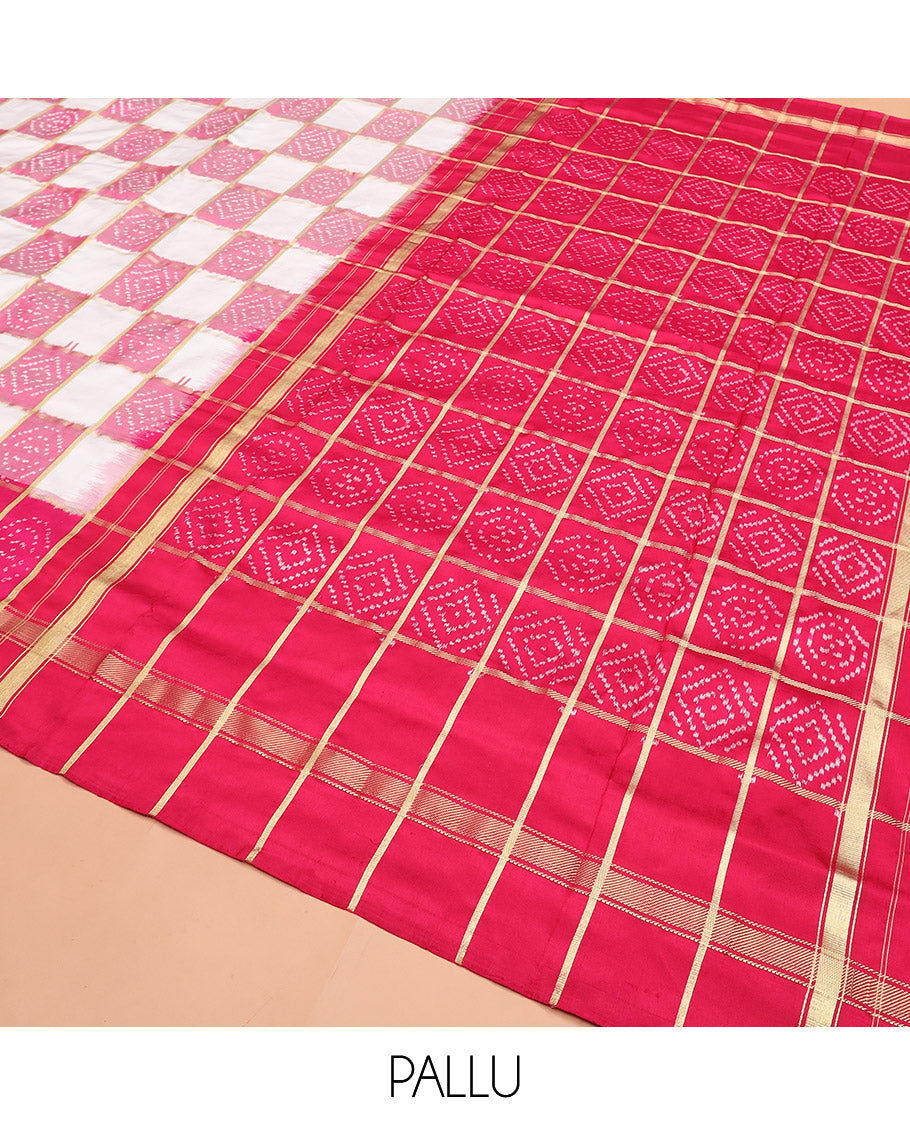 Cream and Pink Ikkat Silk Saree with Ikkat Buttas Enclosed in Checks, Complemented by a Contrast Ikkat Design Border, a Hazily Woven Pallu of Ikkat Patterns, and a Contrast Checked Blouse
