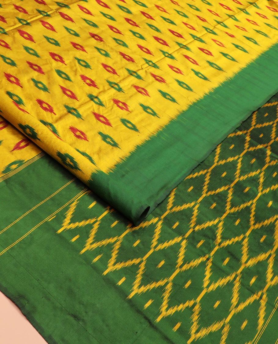 Yellow Ikkat Silk Saree Ornamented with Ikkat Buttas, Featuring a Contrast Plain Border, Complemented by a Pallu Ikkat Woven in an Ogee Pattern