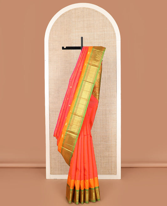 Orange zari buttas Kanchipuram silk saree, contrast one-sided border of paneer sombu, banaras, muthu, and jaal designs, and floral and diamond patterned pallu