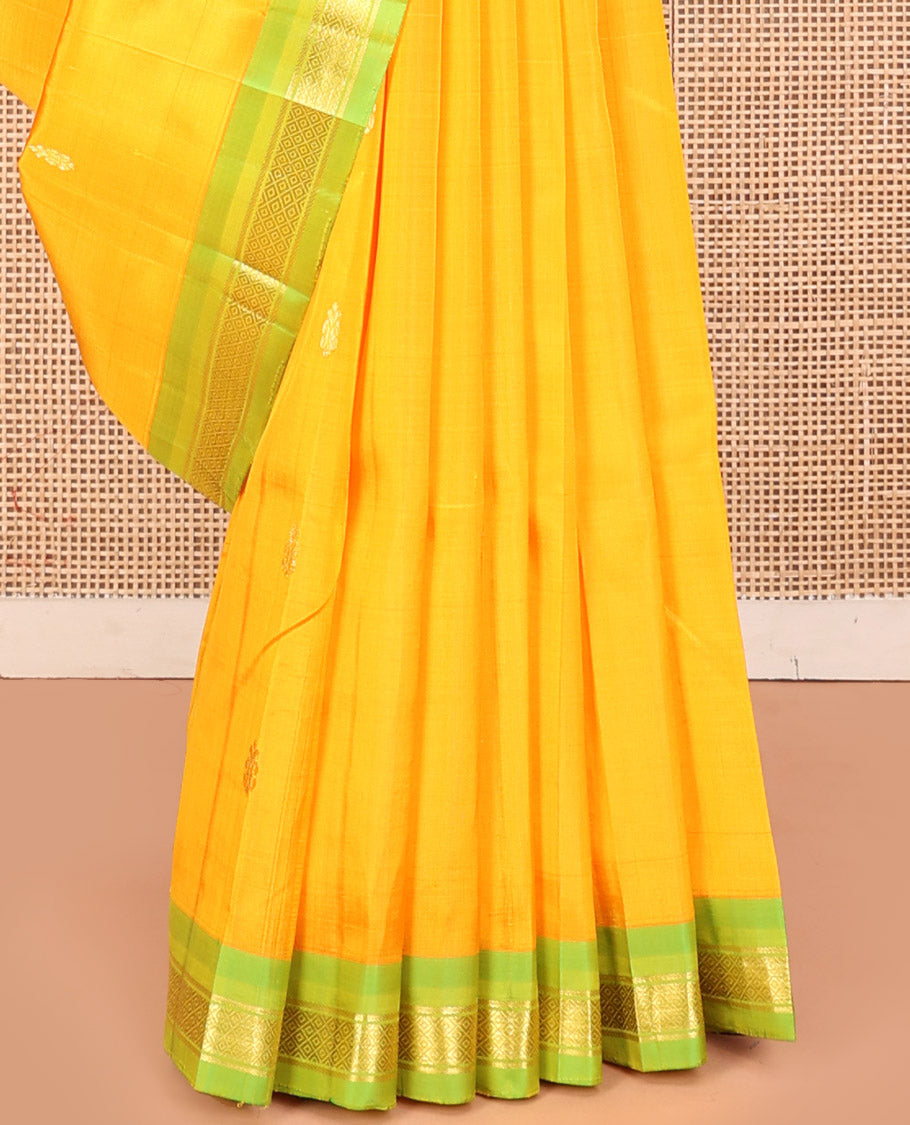 Yellow Kanchipuram Silk Saree, Subtly Sparkled with Zari Buttas, a Contrast One-Sided Border of Banaras, and Mayil Kann Design, Zari-Woven Pallu, and No Blouse